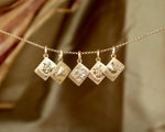 Five Gold Charms celebrating Fall