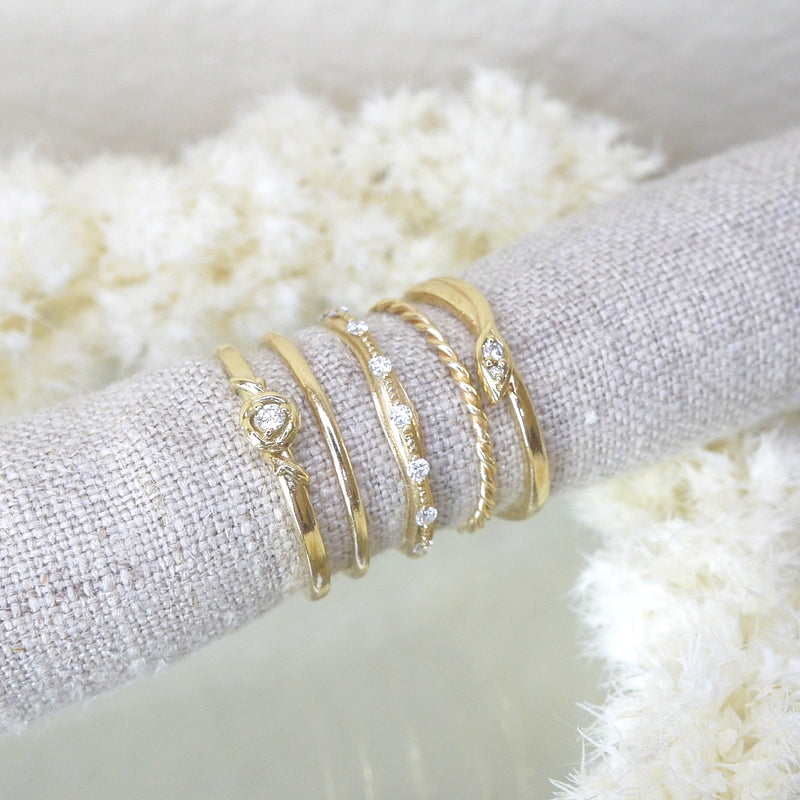 A selection of thin gold rings including 1.3mm twist ring