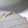 Reflection Baguette Moissanite Two-Tone Gold Necklace Vertical