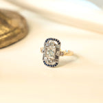 Bespoke art deco inspired ring set with customer's princess cut diamonds, blue sapphire accents