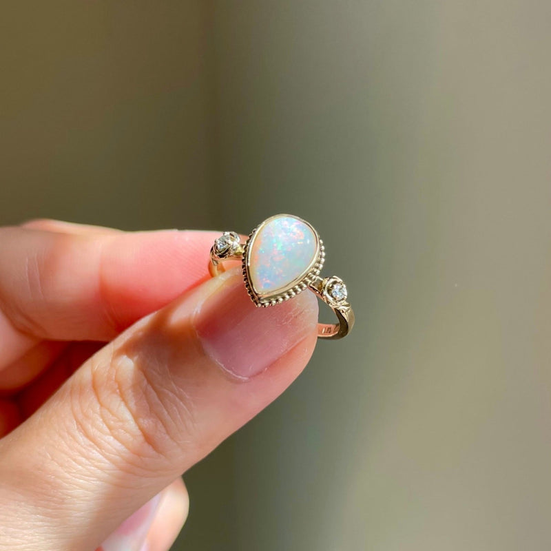 Australian white opal shining under sunshine diamonds sparkling in the roses